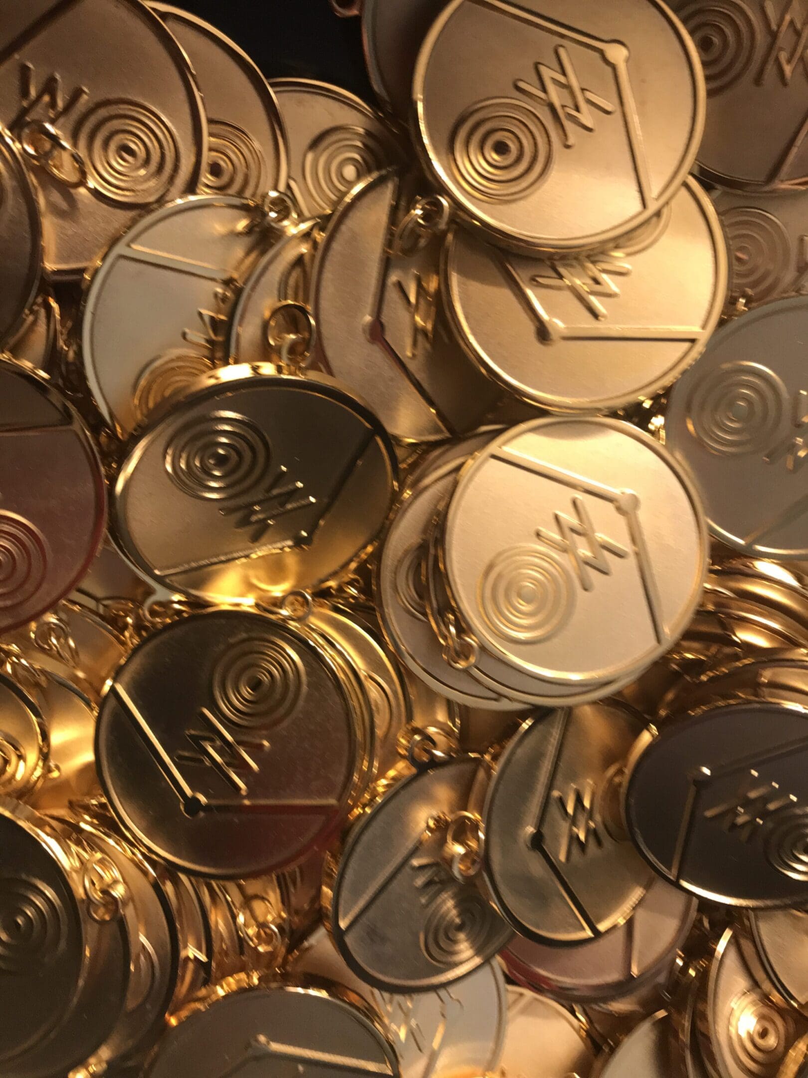 A pile of gold coins with the word " gold " on them.