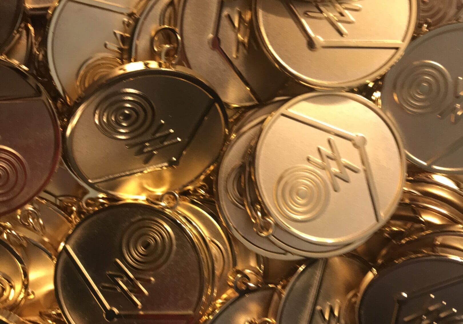 A pile of gold coins with the word " gold " on them.